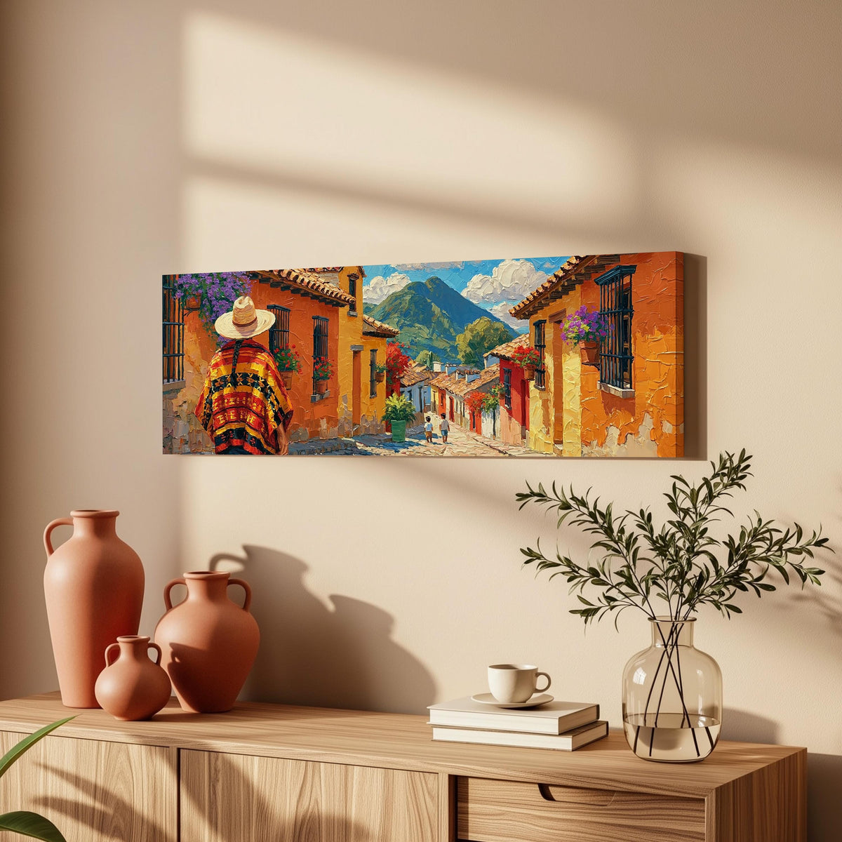 Colorful Guatemalan street with volcano view long horizontal canvas print above a wooden sideboard