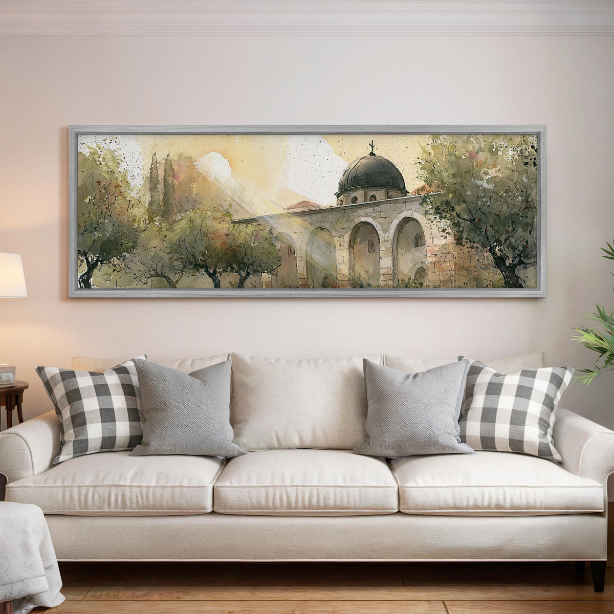 Domed mosque courtyard in watercolor panoramic canvas print above a white sofa in a bright living room