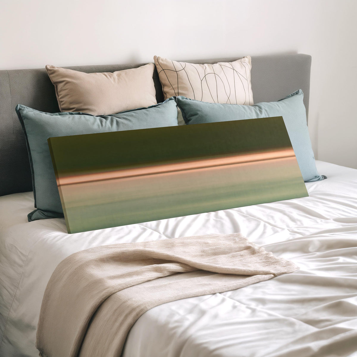 Minimalist dusk horizon gradient wide panoramic canvas print laid on a bed to show its size