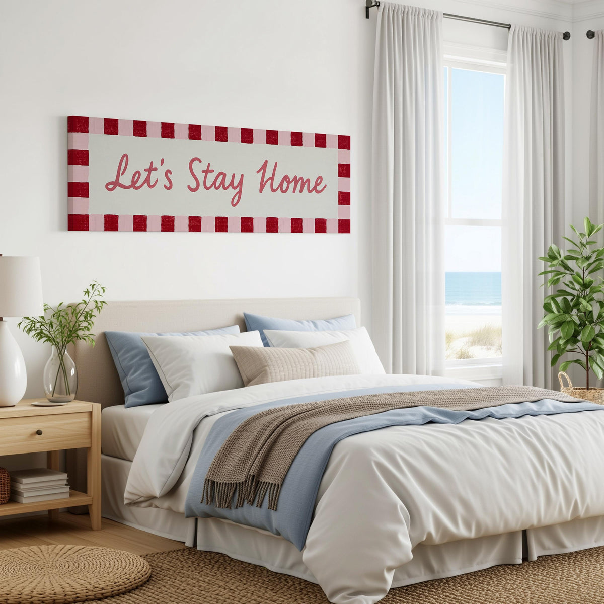 Let's stay home sign with a red checked border panoramic canvas print above a bed in a coastal bedroom