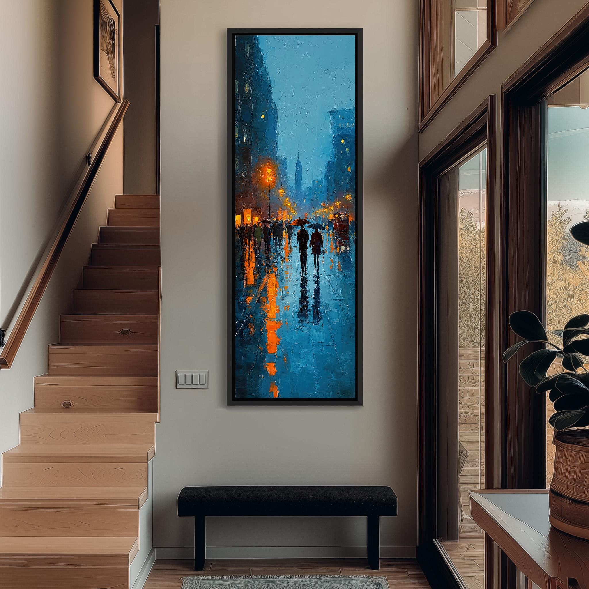 a hallway with a large painting of a rainy city street hanging on the wall. The painting features a group of people walking on the wet street, with the buildings and streetlights reflecting in the water below. The hallway is well-lit, with a staircase leading up to the painting and a bench in the foreground.