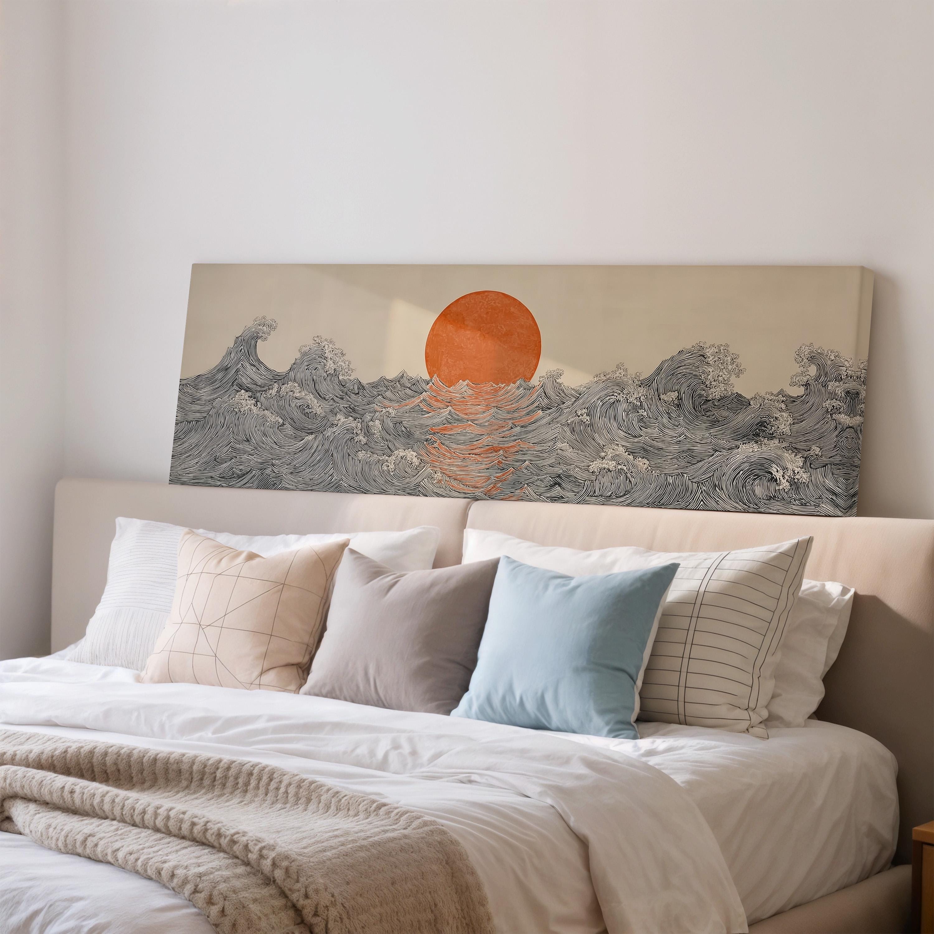 a large bed with white sheets and pillows, and a painting of a sunset over the ocean on the headboard.