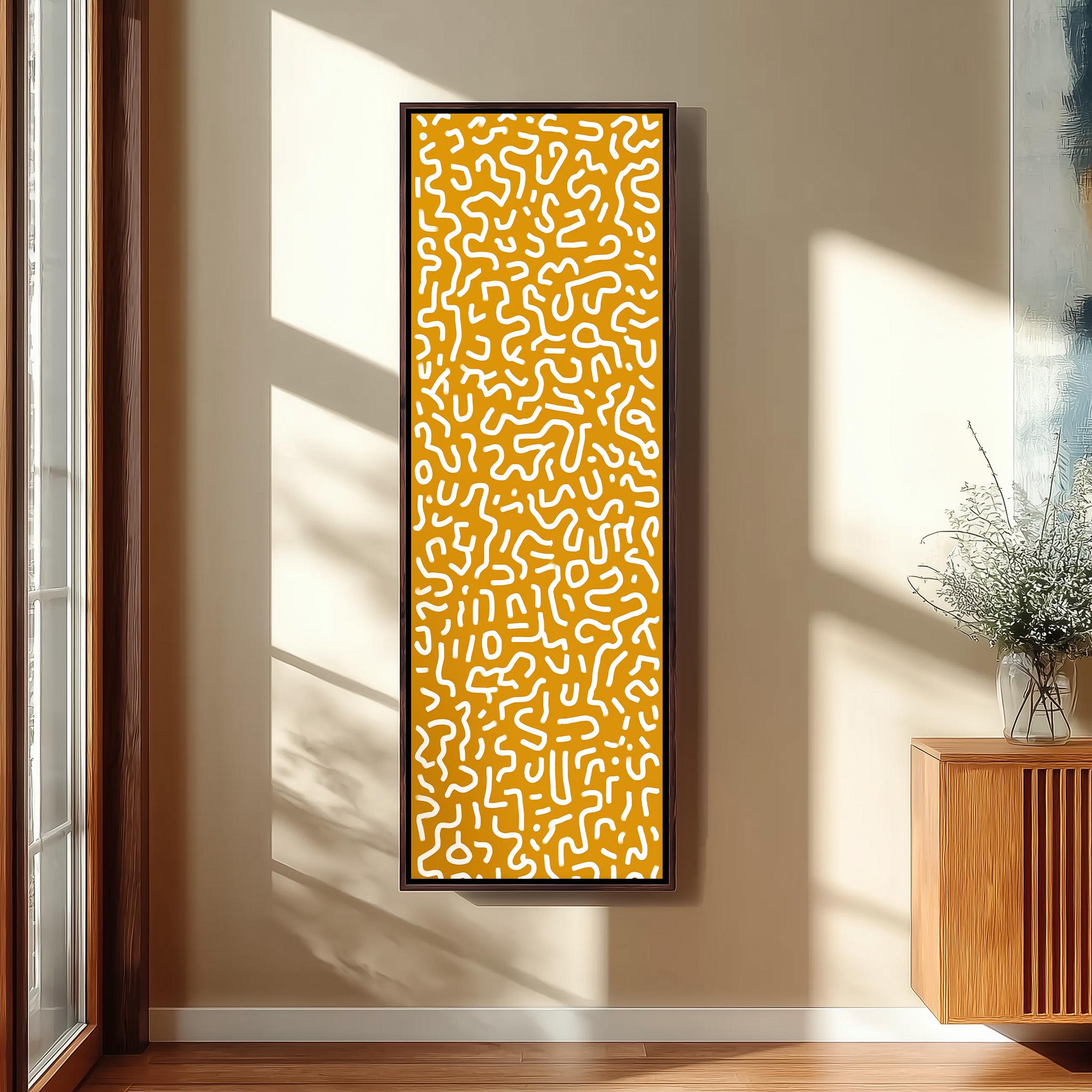 a large, abstract painting with a yellow and white color scheme, hanging on a wall in a room with a wooden cabinet and a vase of flowers.