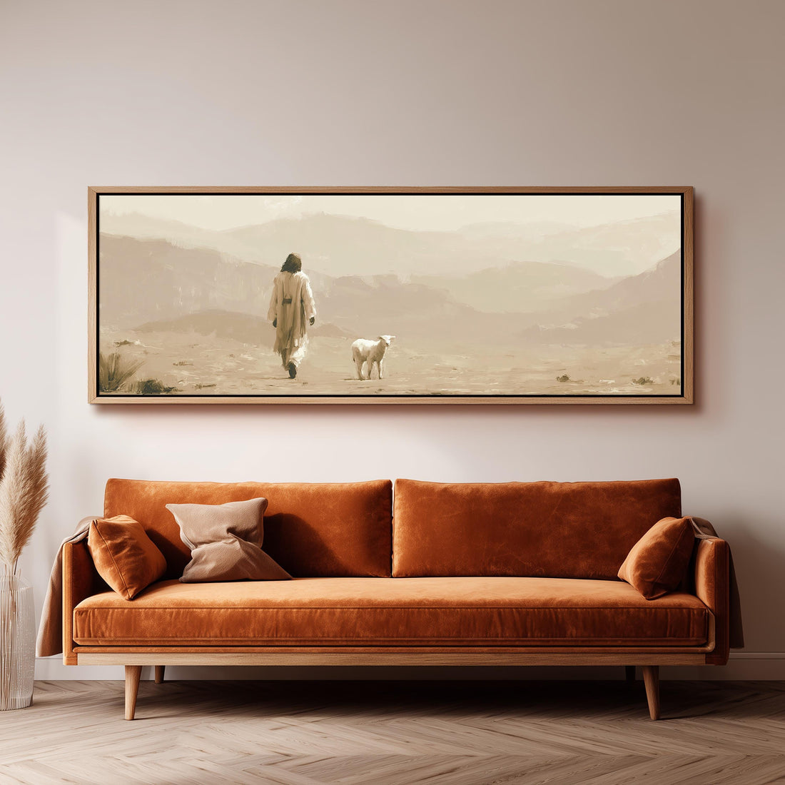 Jesus walking with a lamb through the desert long horizontal canvas print above a sofa in a living room