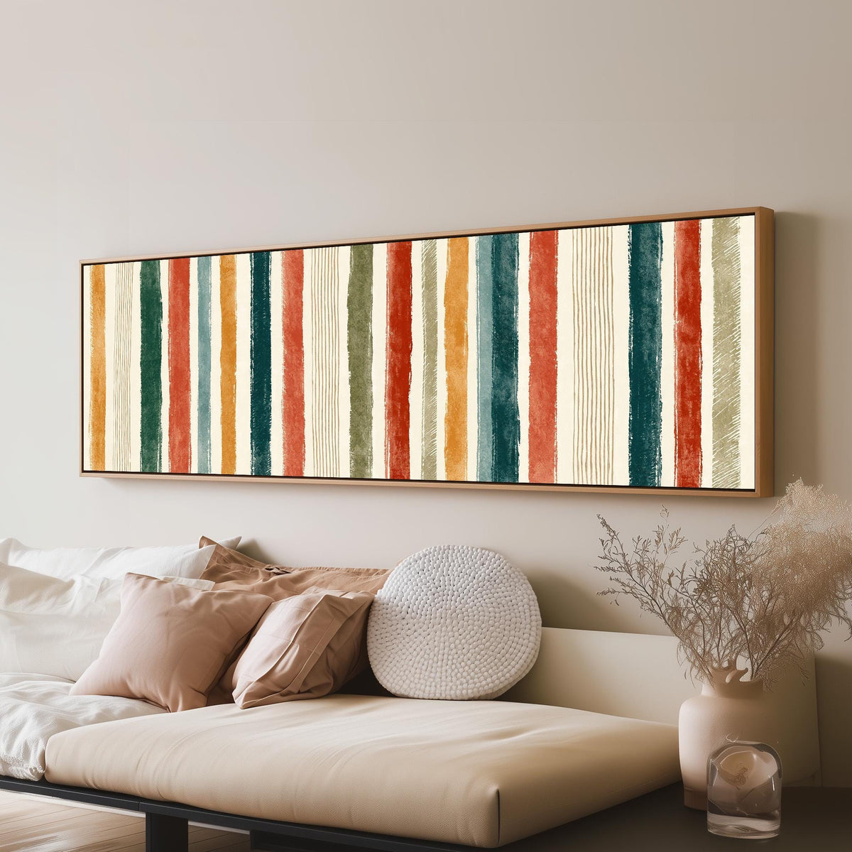 Boho watercolor stripes in mustard, teal and rust long horizontal canvas print above a sofa in a living room