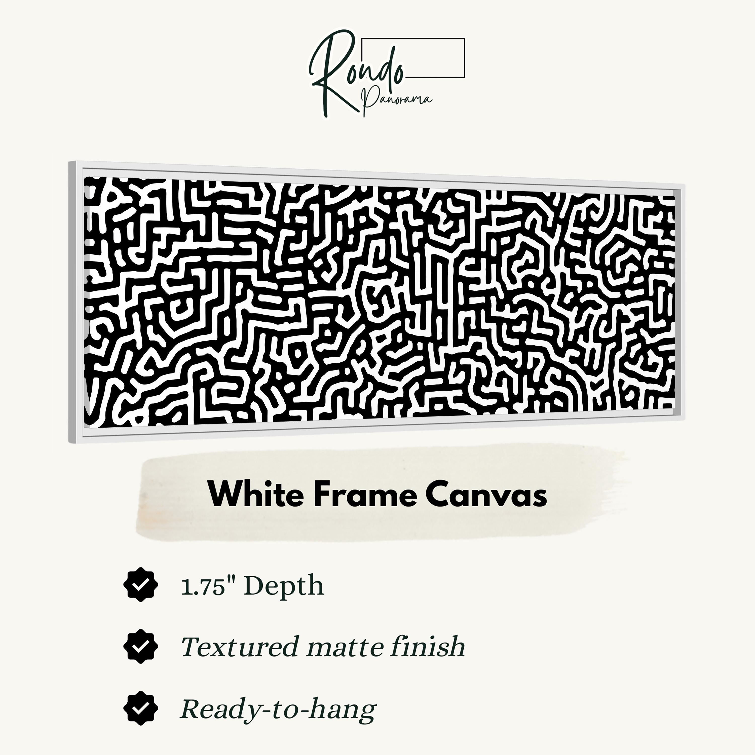 a white frame canvas with a black and white abstract pattern.
