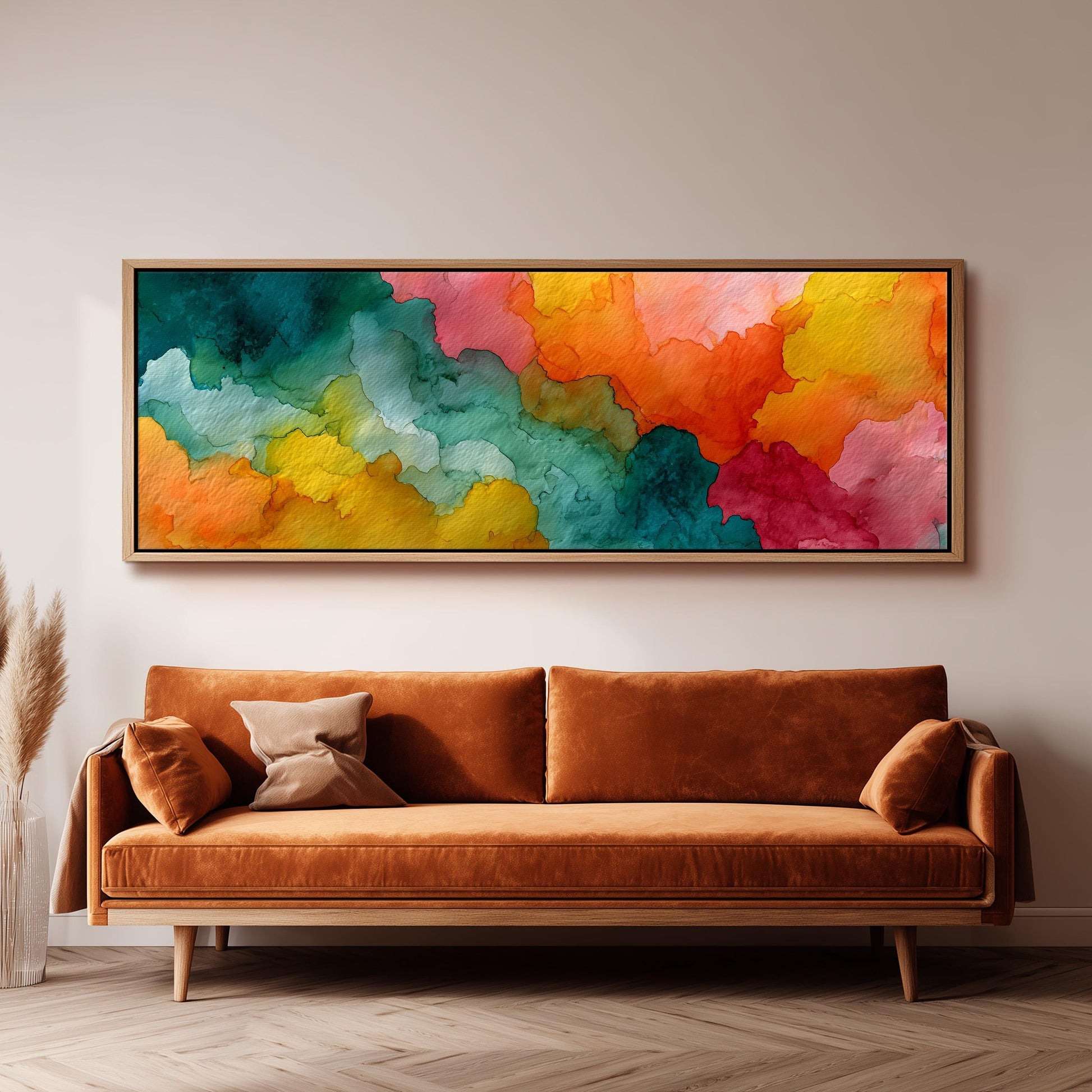 a large, vibrant abstract painting hanging on a wall above a brown sofa.