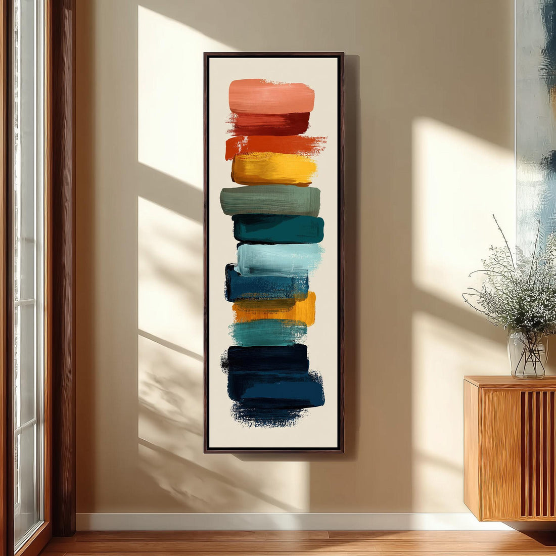 a vibrant abstract painting with bold brushstrokes in various colors, including red, orange, yellow, green, blue, and purple, arranged in a vertical line on a wall.
