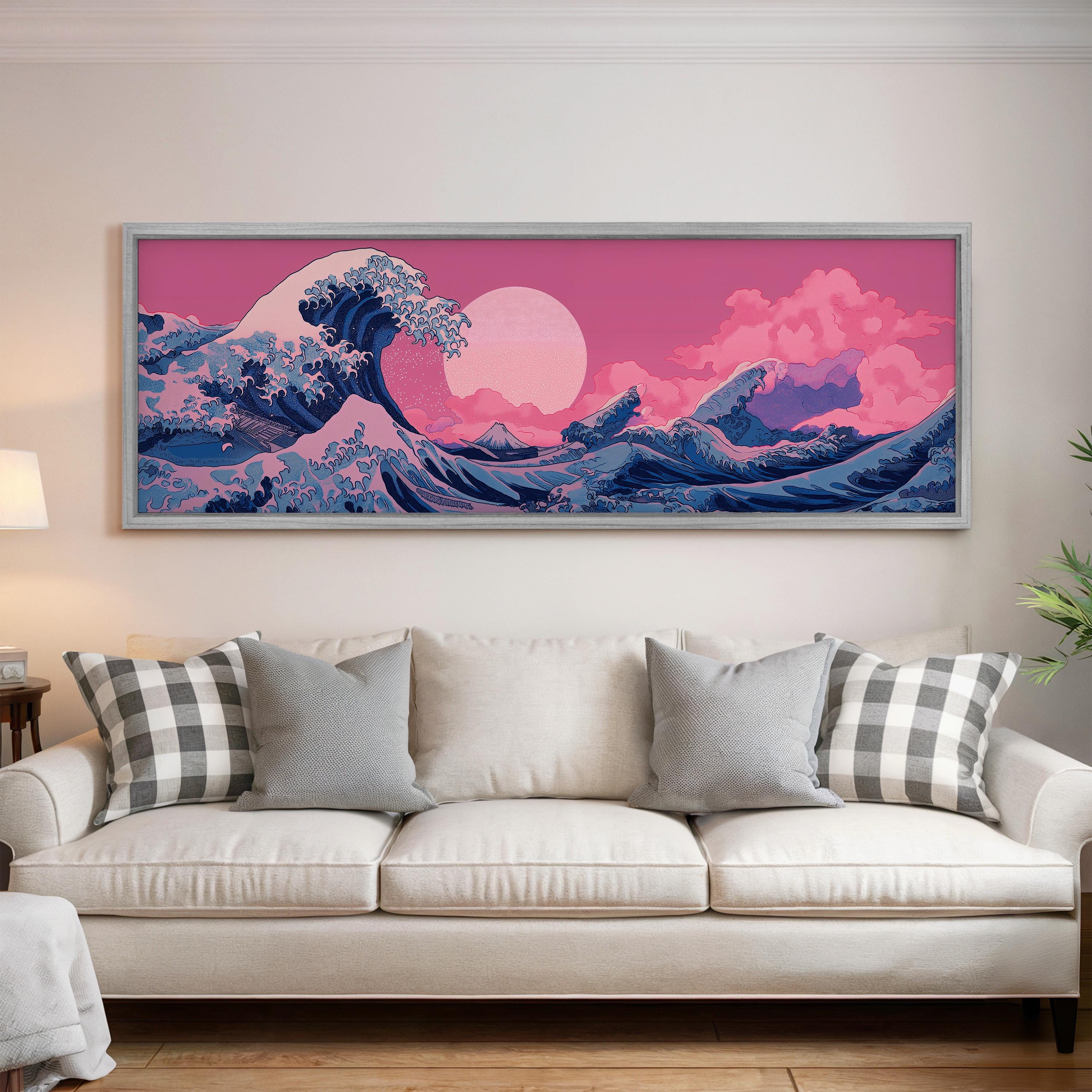 a large, colorful painting of a wave on a wall above a white couch with patterned pillows.