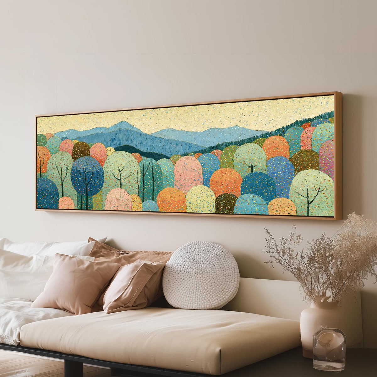 Pastel dotted forest below blue mountains long horizontal canvas print above a sofa in a living room