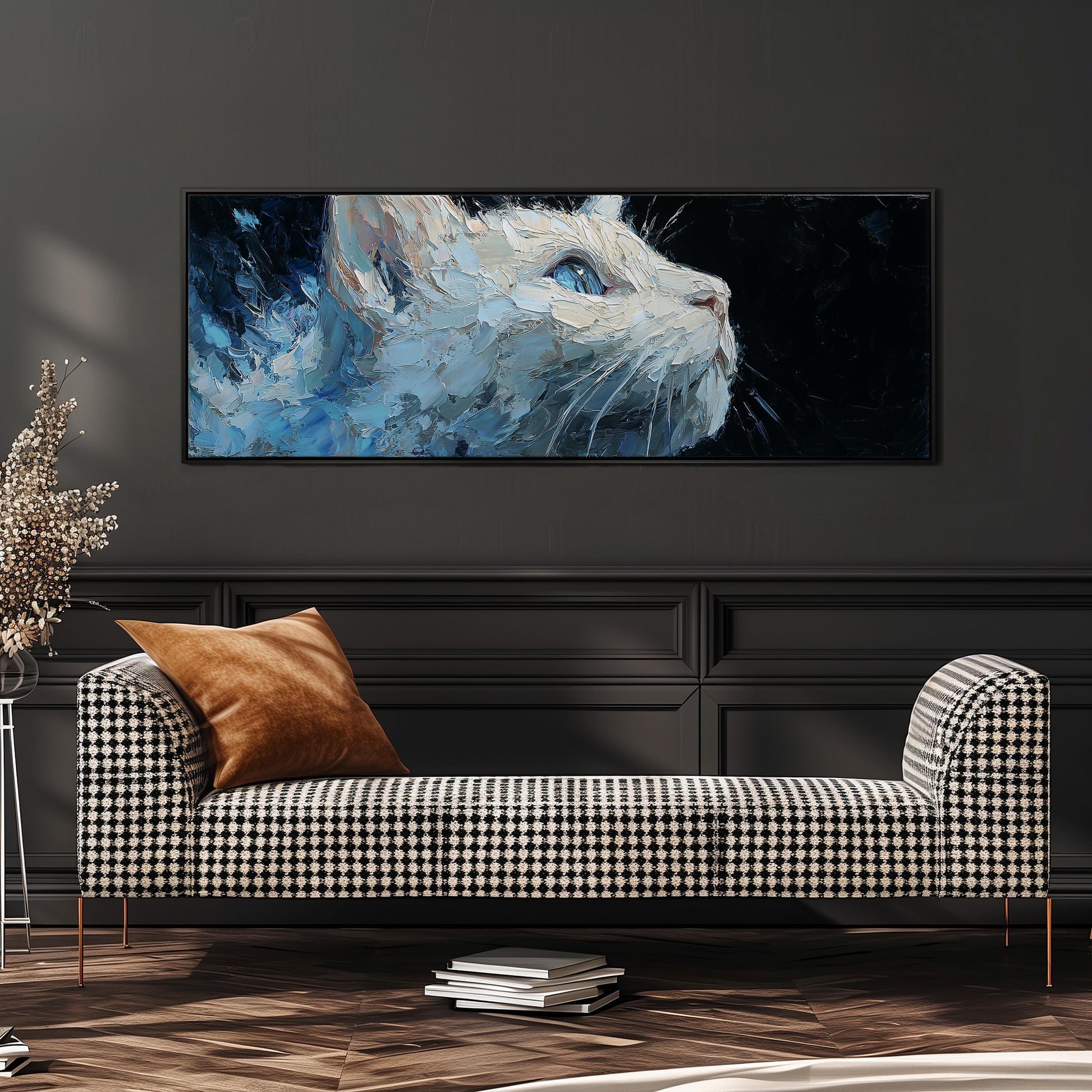 a large, colorful painting of a cat's face hanging on a wall above a black and white checkered sofa in a modern living room setting.