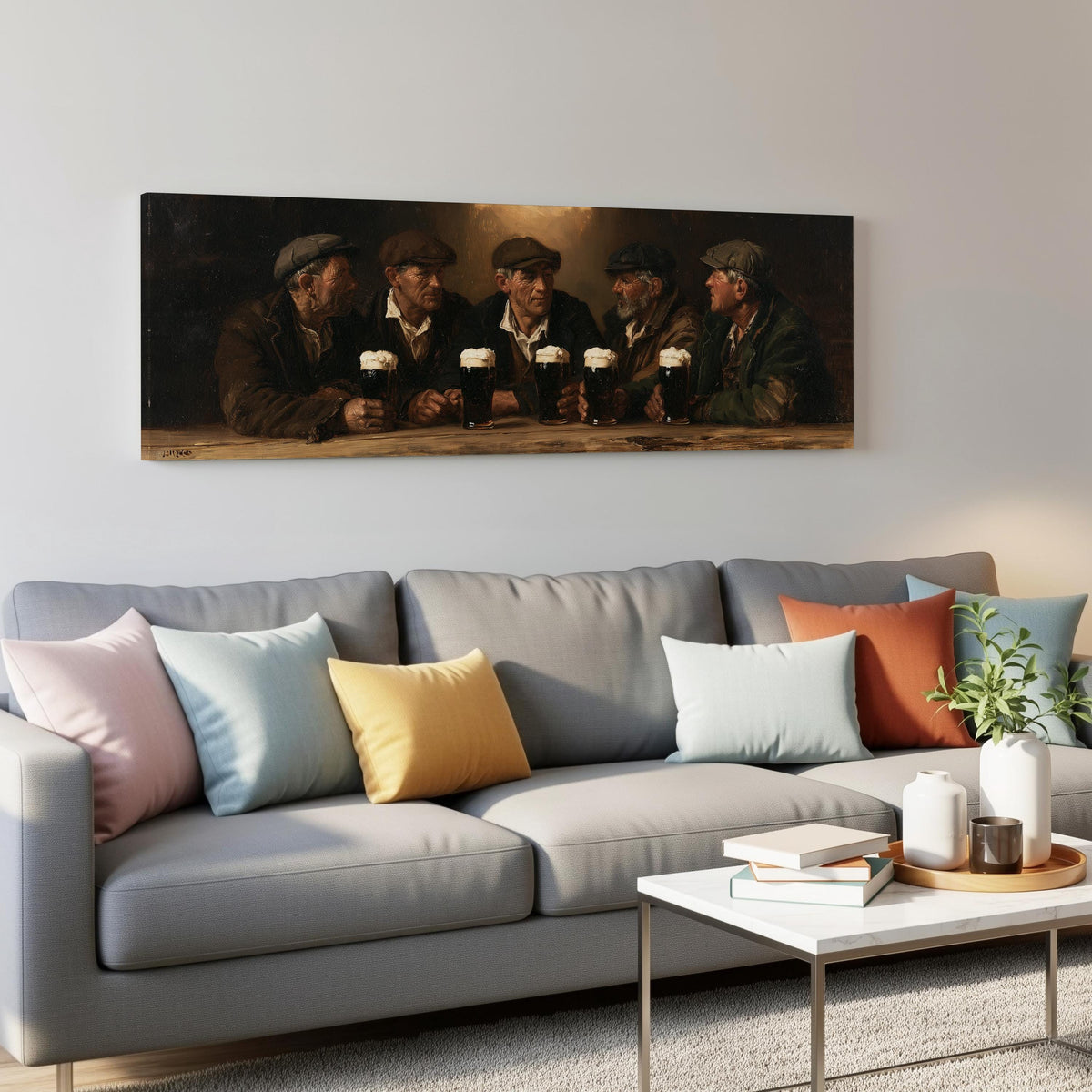 Friends toasting with stout in an Irish pub panoramic canvas print above a grey sofa in a living room