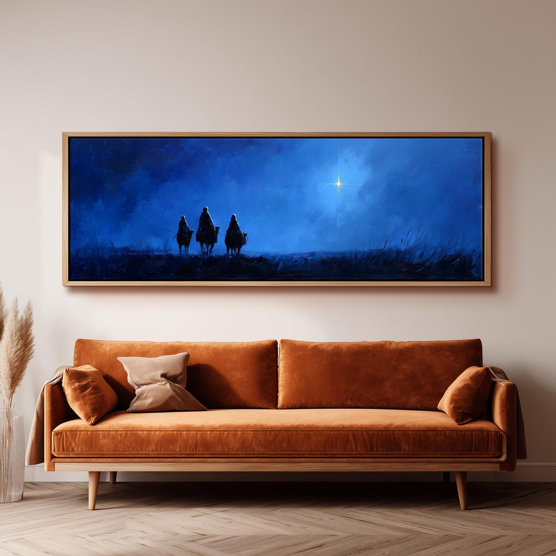 a large black and white checkered sofa with a brown throw pillow, positioned in front of a dark wall with a framed painting depicting three figures silhouetted against a night sky.