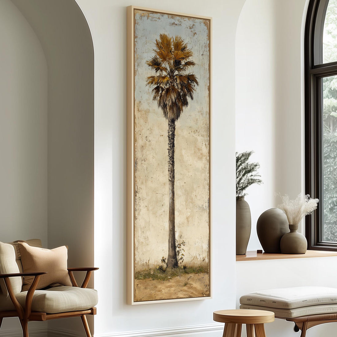 a large framed painting of a palm tree hanging on a wall in a room with a seating area and decorative elements.