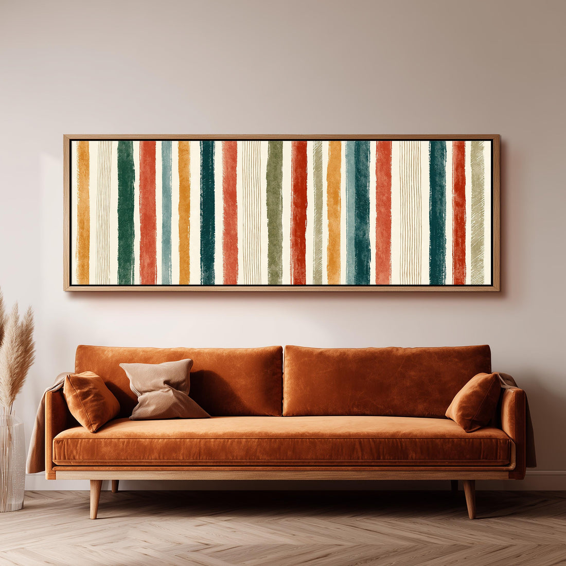 Boho watercolor stripes in mustard, teal and rust long horizontal canvas print above a sofa in a living room