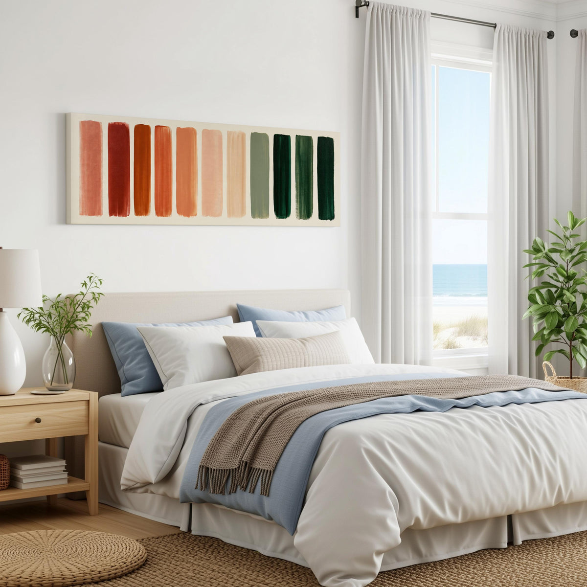 Brushed swatches from terracotta to forest green panoramic canvas print above a bed in a coastal bedroom