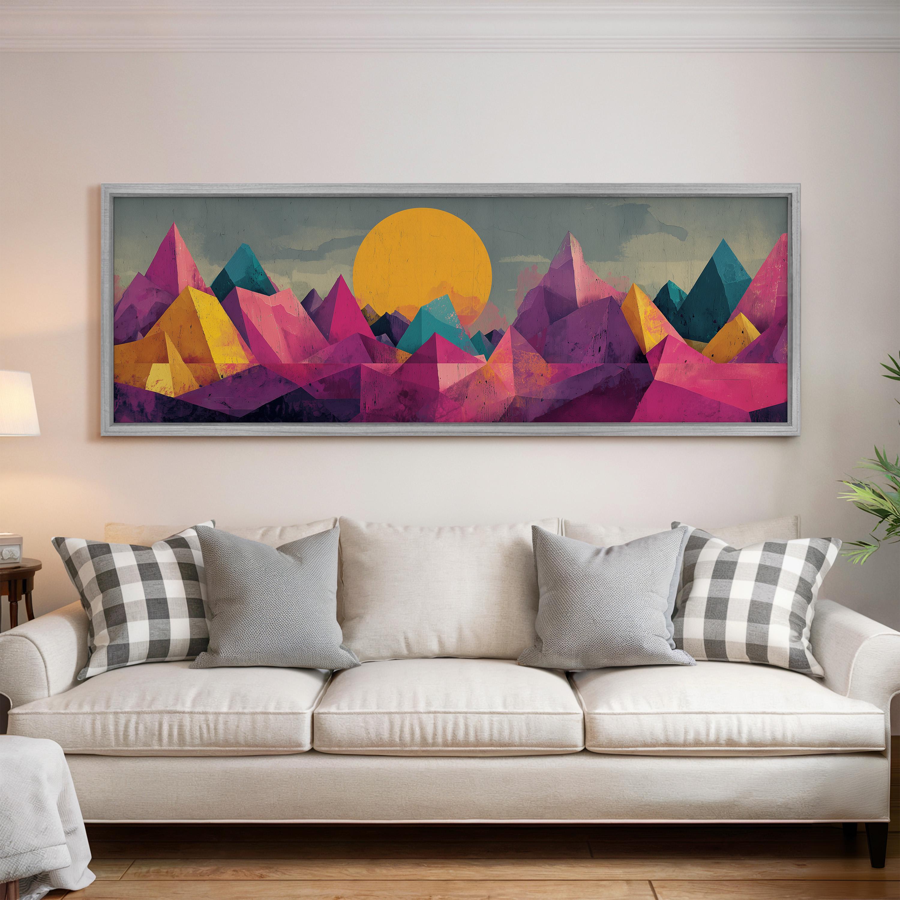 a large, colorful painting of mountains hanging on a wall above a white couch with gray and white plaid throw pillows.